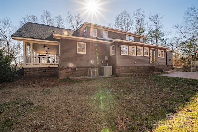 rear view of property with cooling unit, a lawn, ceiling fan, and a porch