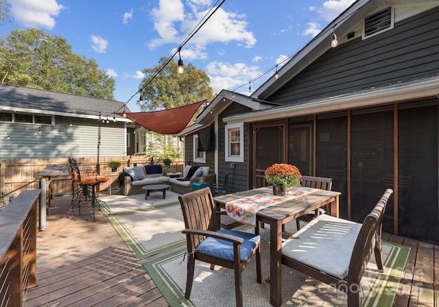 deck featuring outdoor dining space and outdoor lounge area