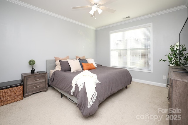 carpeted bedroom featuring ornamental molding and ceiling fan