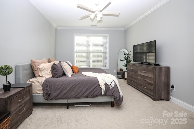 bedroom featuring ornamental molding, light colored carpet, and ceiling fan