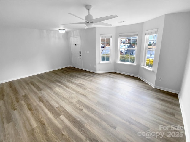 spare room with ceiling fan and light hardwood / wood-style flooring