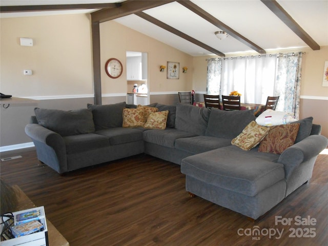 living room with dark hardwood / wood-style floors and lofted ceiling with beams