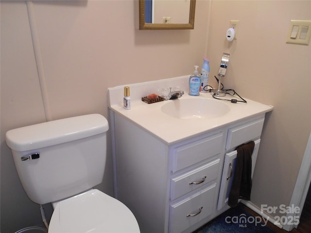 bathroom with vanity and toilet