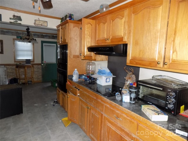 kitchen featuring ceiling fan, black appliances, and a textured ceiling