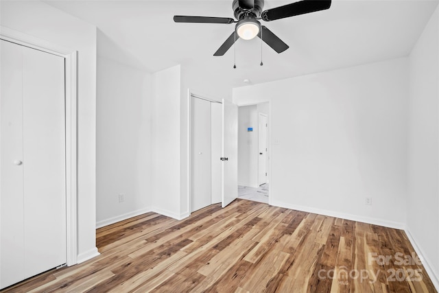 unfurnished bedroom featuring light hardwood / wood-style flooring and ceiling fan