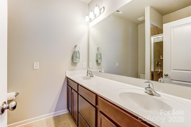 full bathroom featuring tile patterned floors, vanity, toilet, and  shower combination