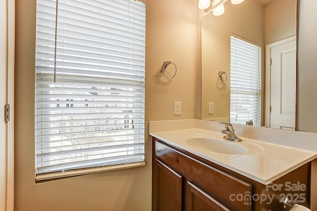 bathroom featuring vanity and a healthy amount of sunlight