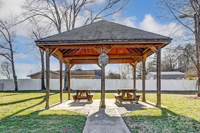 surrounding community with a gazebo, a lawn, and a patio area