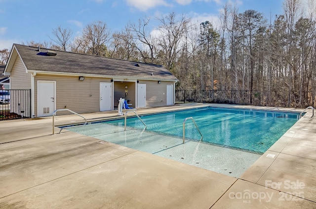 view of swimming pool with a patio area