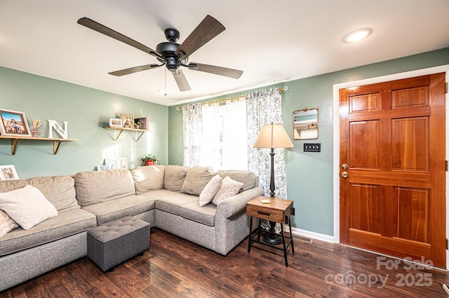 living area with ceiling fan, wood finished floors, and baseboards