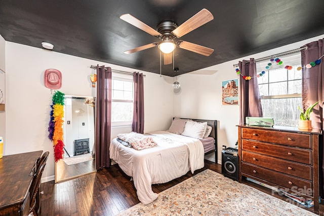 bedroom with hardwood / wood-style flooring and ceiling fan