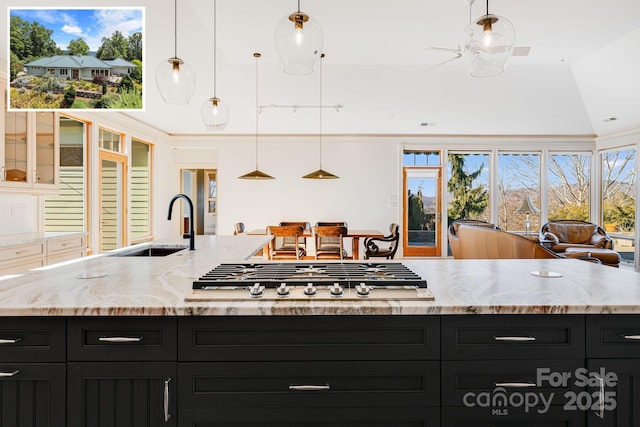 kitchen featuring pendant lighting, sink, a wealth of natural light, and stainless steel gas stovetop