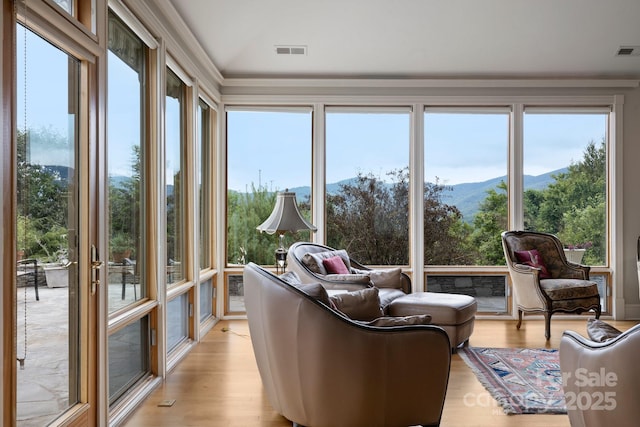 sunroom with a mountain view