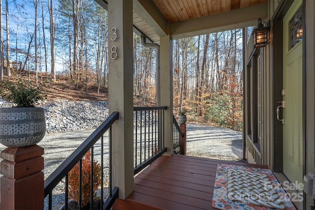 wooden terrace with a porch