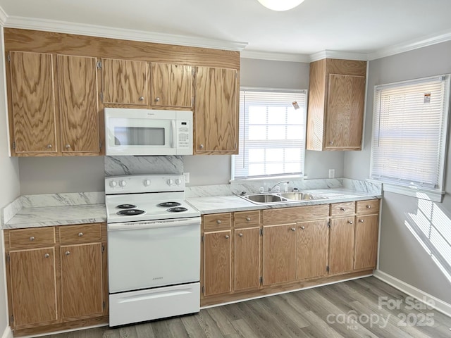 kitchen with crown molding, white appliances, dark hardwood / wood-style flooring, and sink