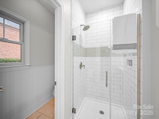 bathroom featuring an enclosed shower and tile patterned flooring