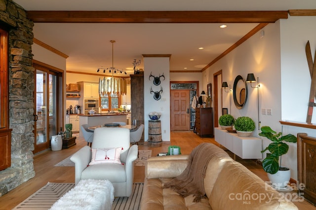 living room with crown molding, beamed ceiling, and light wood-type flooring