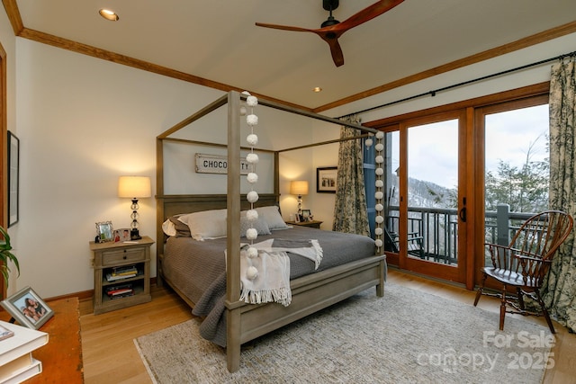 bedroom featuring crown molding, access to exterior, and light hardwood / wood-style floors