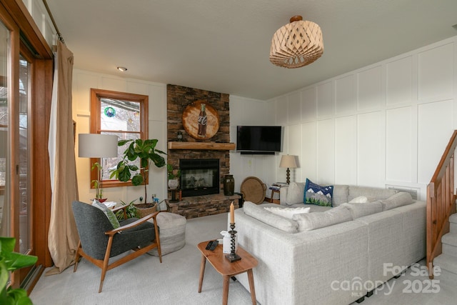 living room with light colored carpet and a fireplace