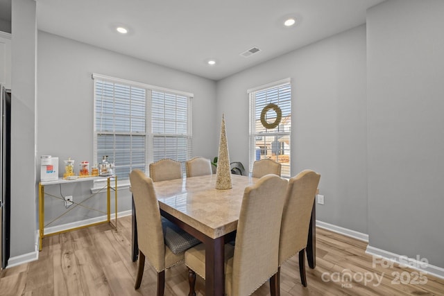 dining room with light wood-type flooring