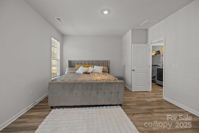 bedroom with wood-type flooring