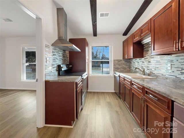 kitchen featuring sink, appliances with stainless steel finishes, light stone countertops, wall chimney exhaust hood, and light wood-type flooring