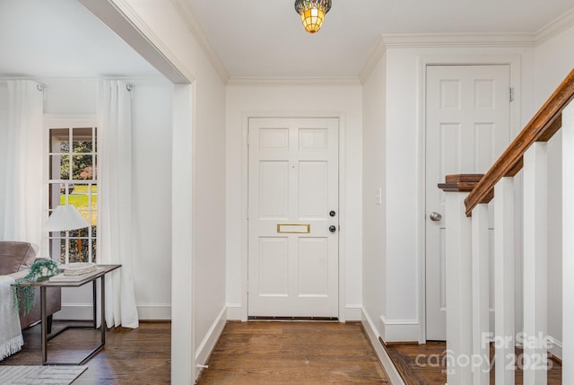 entryway with dark wood-style floors, stairs, baseboards, and crown molding