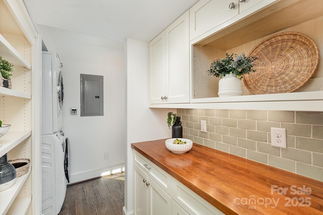 kitchen with stacked washer and dryer, white cabinetry, wooden counters, electric panel, and open shelves