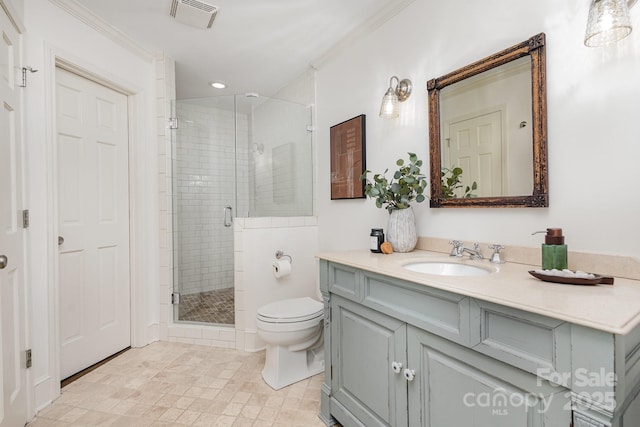 bathroom featuring a stall shower, visible vents, vanity, and toilet