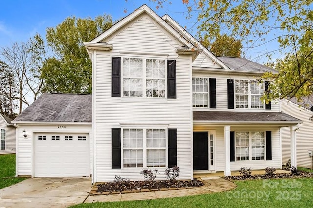 front facade with a garage and a front lawn