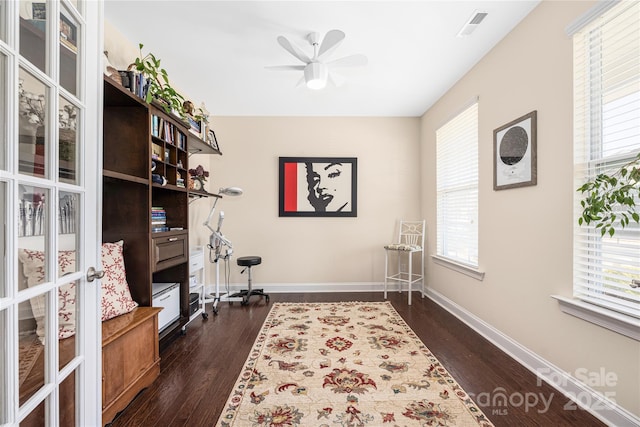 home office featuring ceiling fan and dark hardwood / wood-style flooring