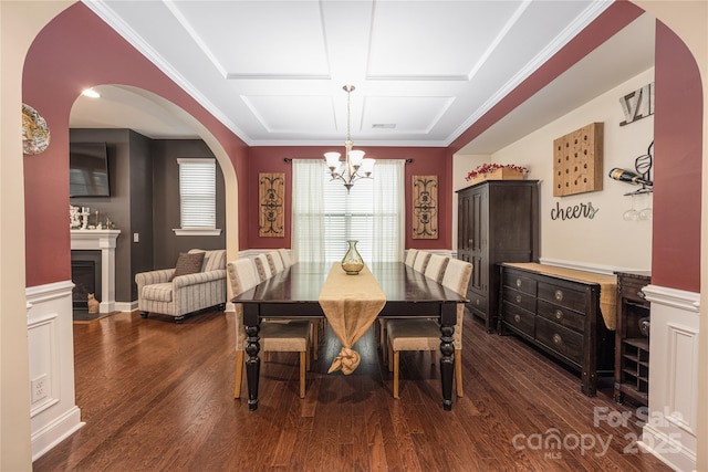 dining space with crown molding, coffered ceiling, a notable chandelier, and dark hardwood / wood-style flooring