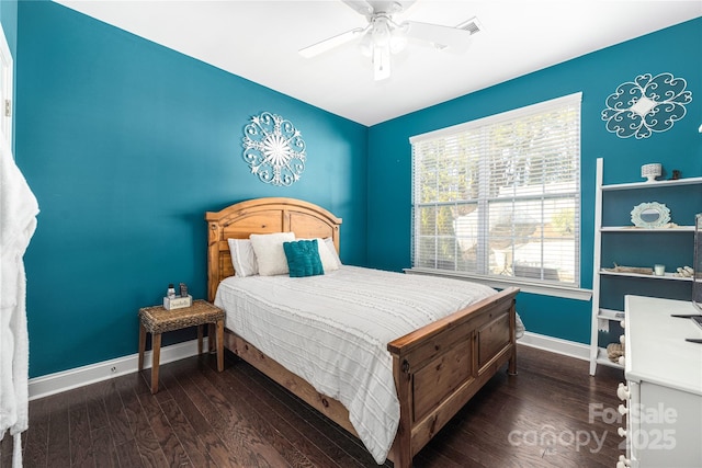 bedroom featuring dark hardwood / wood-style flooring and ceiling fan