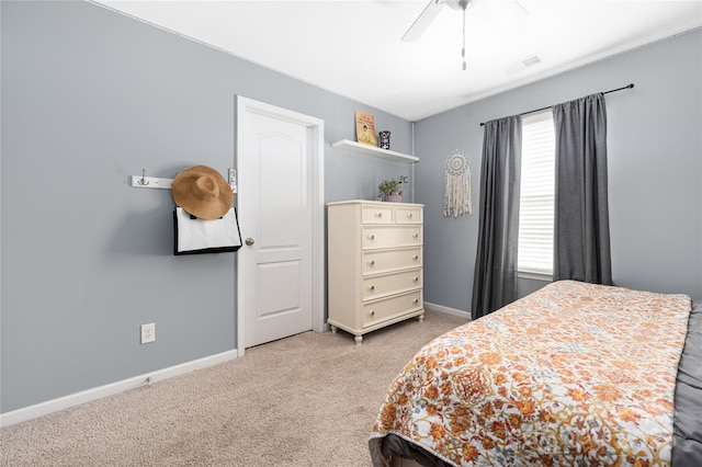 bedroom with light colored carpet and ceiling fan