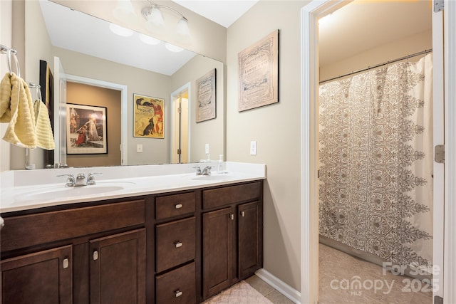 bathroom with vanity and tile patterned flooring