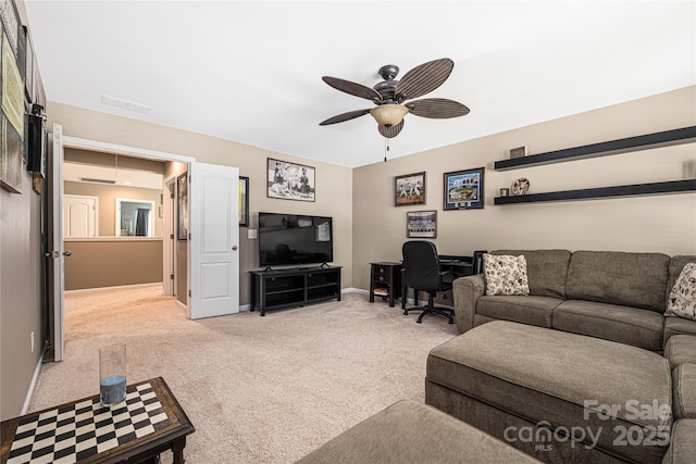 living room with ceiling fan and light carpet