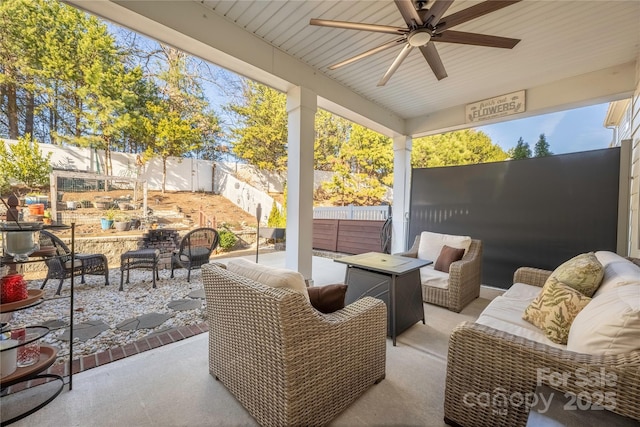 exterior space with outdoor lounge area and ceiling fan