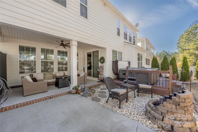 view of patio / terrace with ceiling fan, outdoor lounge area, and a hot tub