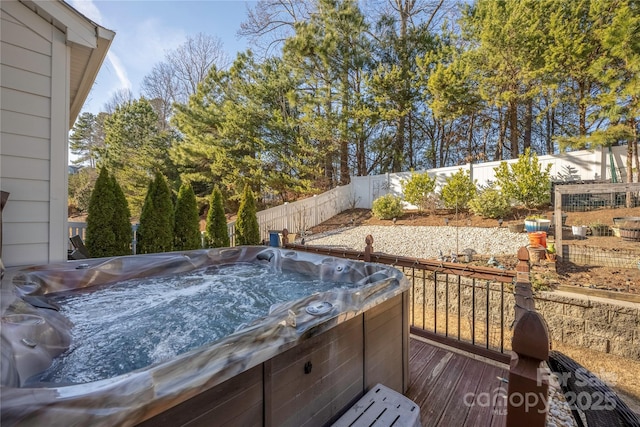 deck with a hot tub