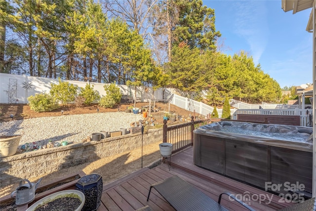 deck featuring a hot tub