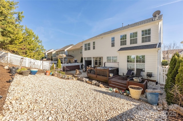 back of property featuring an outdoor living space and a deck