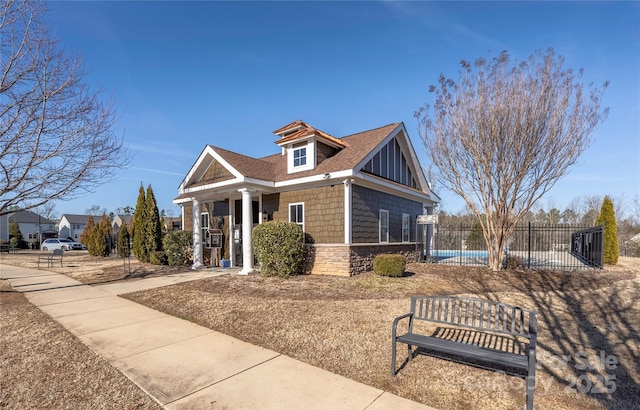 view of front of house featuring a swimming pool