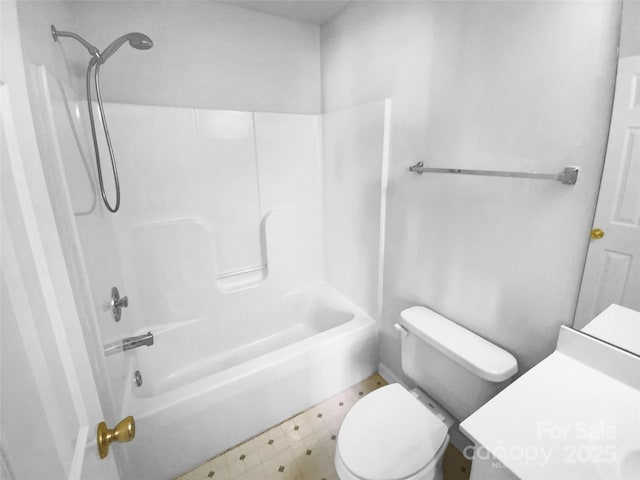 bathroom featuring bathtub / shower combination and toilet