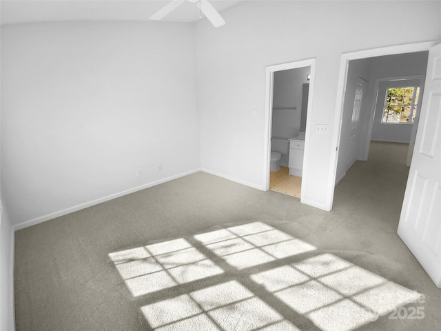 unfurnished bedroom with ensuite bath, ceiling fan, and carpet flooring