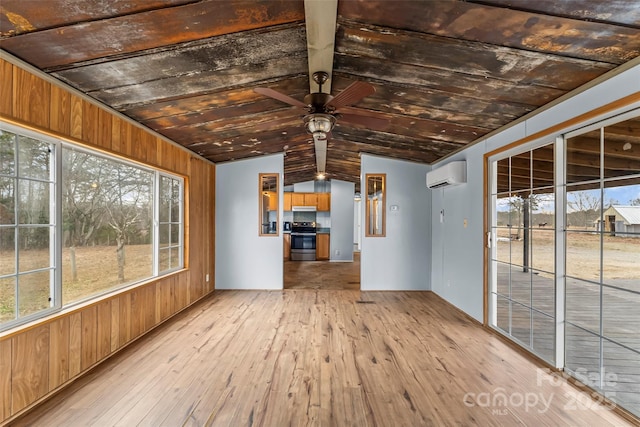 unfurnished sunroom with lofted ceiling, a wall mounted air conditioner, and ceiling fan