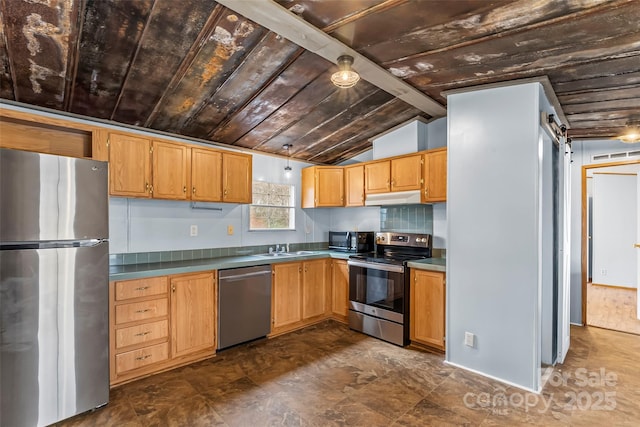 kitchen featuring sink, vaulted ceiling with beams, stainless steel appliances, wooden ceiling, and a barn door