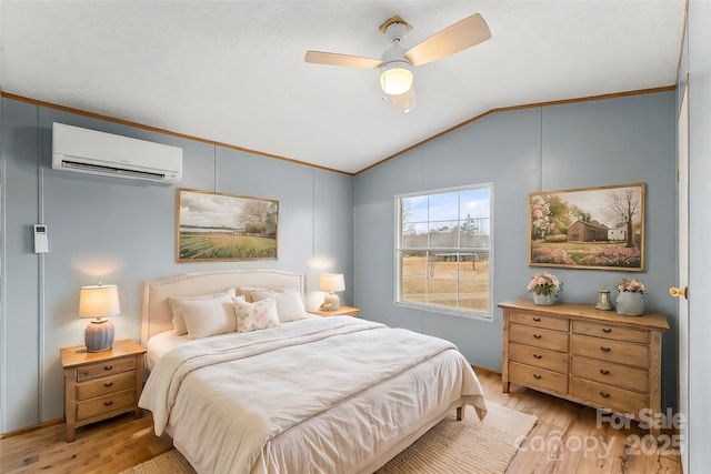 bedroom featuring lofted ceiling, light hardwood / wood-style flooring, ceiling fan, a wall mounted air conditioner, and ornamental molding