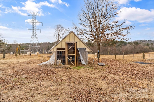 view of outdoor structure with a rural view