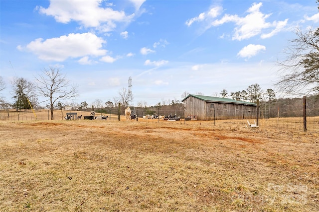 view of yard with a rural view