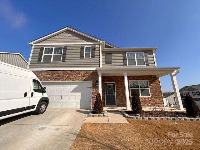 front facade featuring a garage and a porch